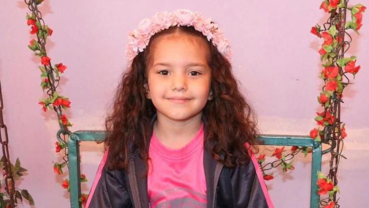 Hind Rajab smiles at the camera.