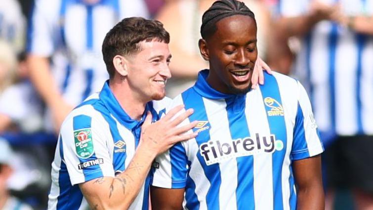 Jamal Lowe (right) and Louie Barry celebrate after Lowe's goal against Bolton