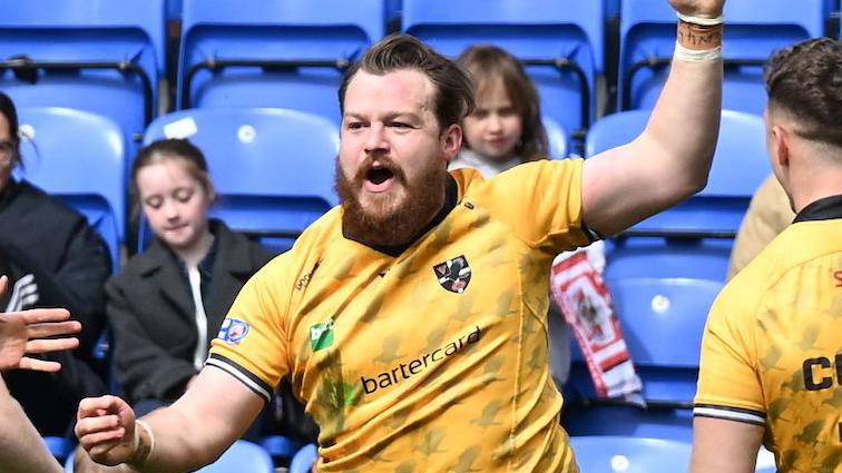 Tom Ashton celebrates a try