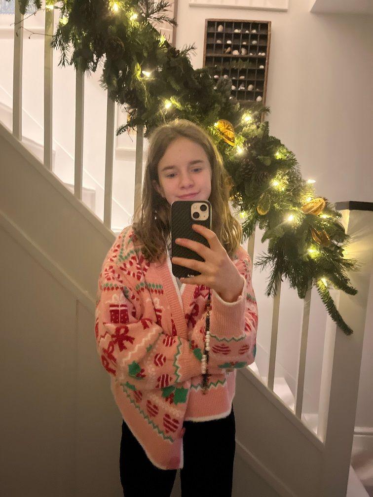 girl in a Christmas cardigan