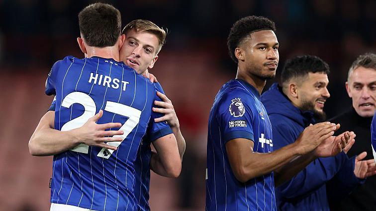 Liam Delap hugged by George Hirst