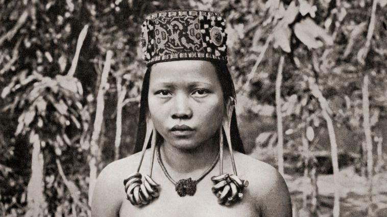 A Kenyah woman from Sarawak, Borneo, Malaysia, with distended ear lobes. 