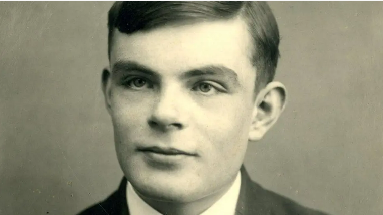 A black and white photo of a man in a white shirt and blazer. 