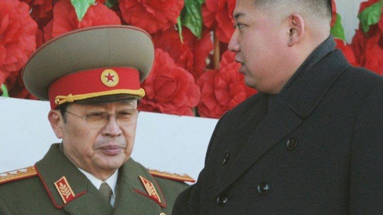 North Korean leader Kim Jong-un (R), flanked by his uncle North Korean politician Chang Song-thaek, at a military parade in Pyongyang on 16 November 2012