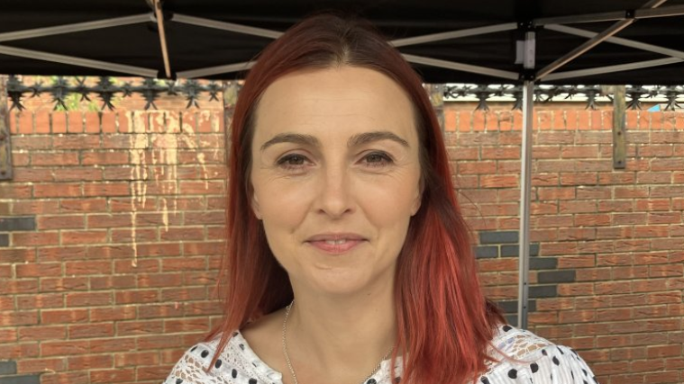 MP Melanie Onn in front of a red brick wall