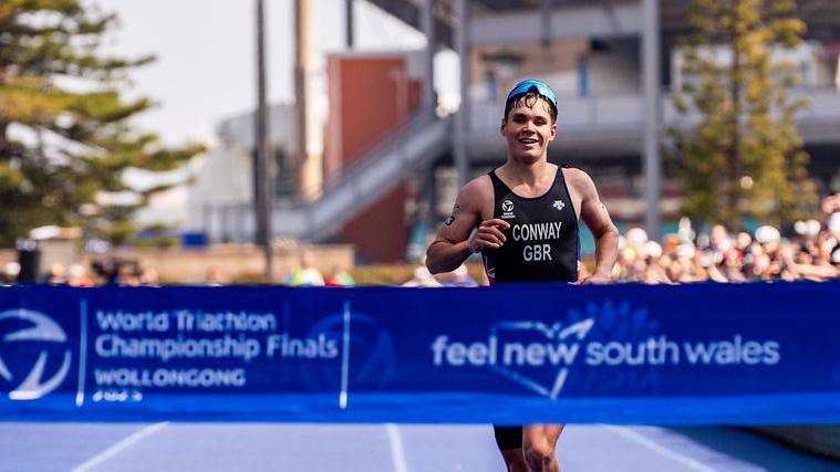 Great Britain's Oliver Conway crossing the finish line in first