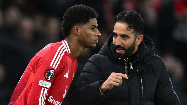 Marcus Rashford and Ruben Amorim talking on the touchline