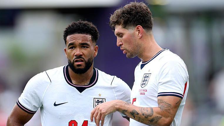 Reece James and John Stones in action for England