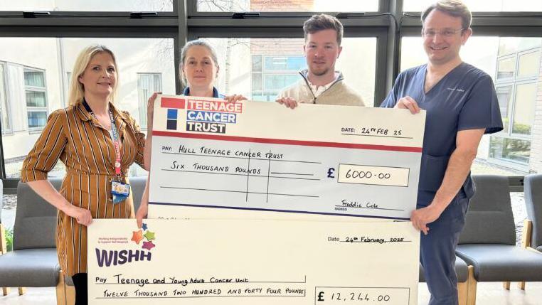 Four people hold up two giant cheques, one to Hull Teenage Cancer Trust for £6,000 and the other to the Teenage and Young Adult Cancer Unit for over £12,000.