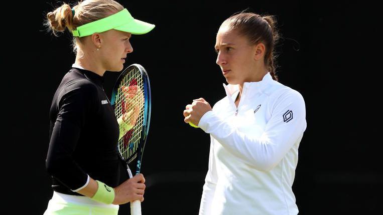 Harriet Dart and Diane Parry discuss tactics during a match at the Nottingham Open in June.