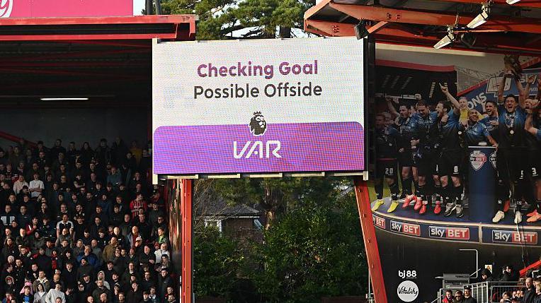 The LED board shows the Video Assistant Referee check for a possible offside during the Premier League match between Bournemouth and Chelsea