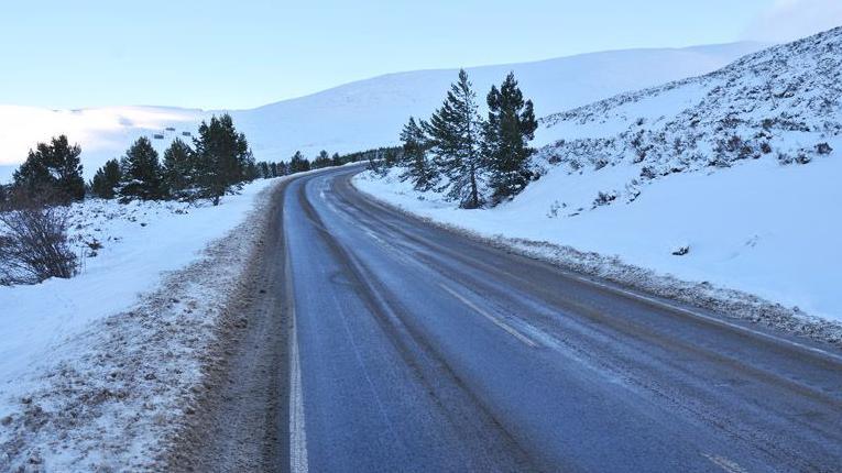 Cairngorm ski road with snow on either side of the road