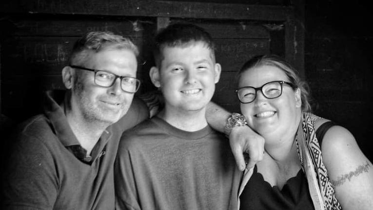 Bradley (centre) with his father Simon (left) and Rebecca Hadman