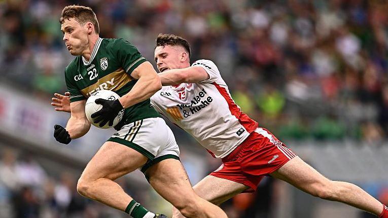 Gavin White is challenged by Eoin McElholm in Kerry's quarter-final win over Tyrone