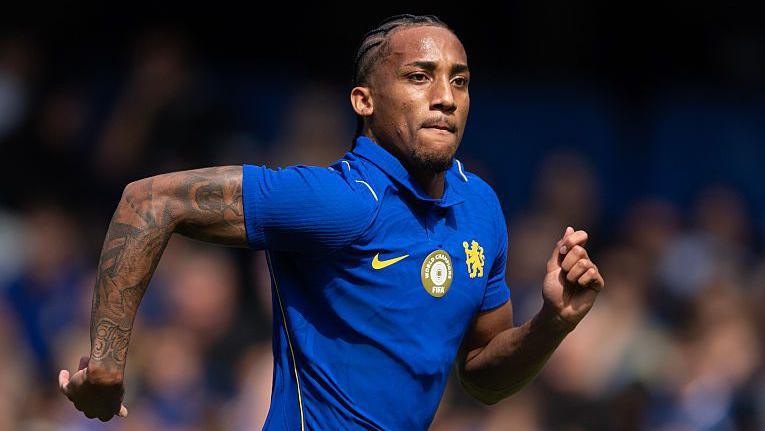 Joao Pedro running and concentrating while playing for Chelsea