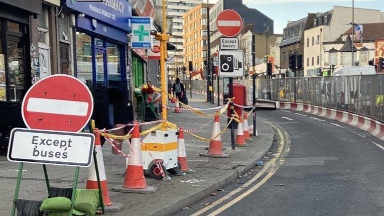 Roadworks on Wembley High Road with no entry signs.