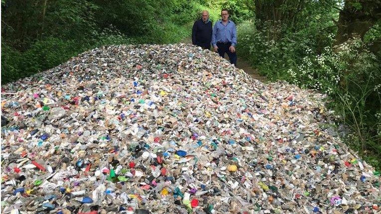 Basingstoke councillor Mark Ruffell (left) and council leader Ken Rhatigan with fly-tipped rubbish