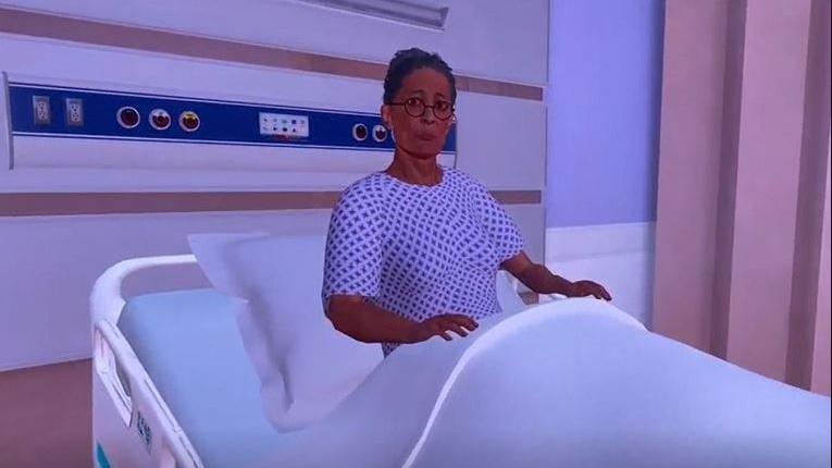 An AI-generated avatar of a virtual patient sits up in a hospital bed. She is wearing a hospital gown.