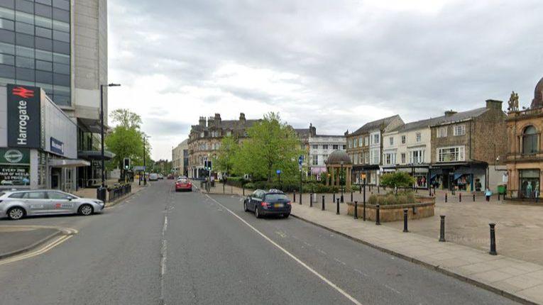 The same location as the digitally-drawn image. However, this is a photo of how it looks now. It looks almost the same, however the taxi rank area is much larger here, there is no cycle lane, the pavement on the left is about half as wide, and the pedestrian crossing appears less clear.