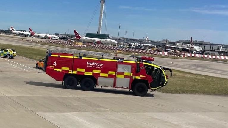 A Heathrow fire and rescue truck on a runway.