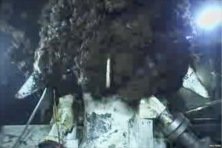 Frame grab of oil and gas continuing to leak out of the containment cap at the Deepwater Horizon oil spill site in the Gulf of Mexico