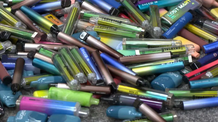 A pile of different coloured and different style vapes