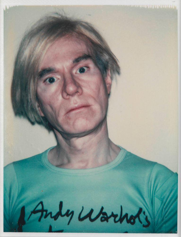 Andy Warhol Self-Portrait in Interview T-shirt 1977-8
It is a photo of Andy Warhol, looking at the camera wearing a T-shirt with Andy Warhol written on it 