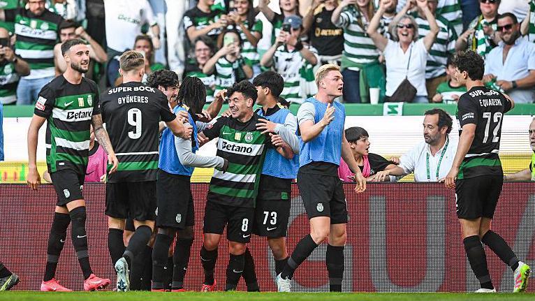 Sporting players celebrate after scoring against Guimaraes