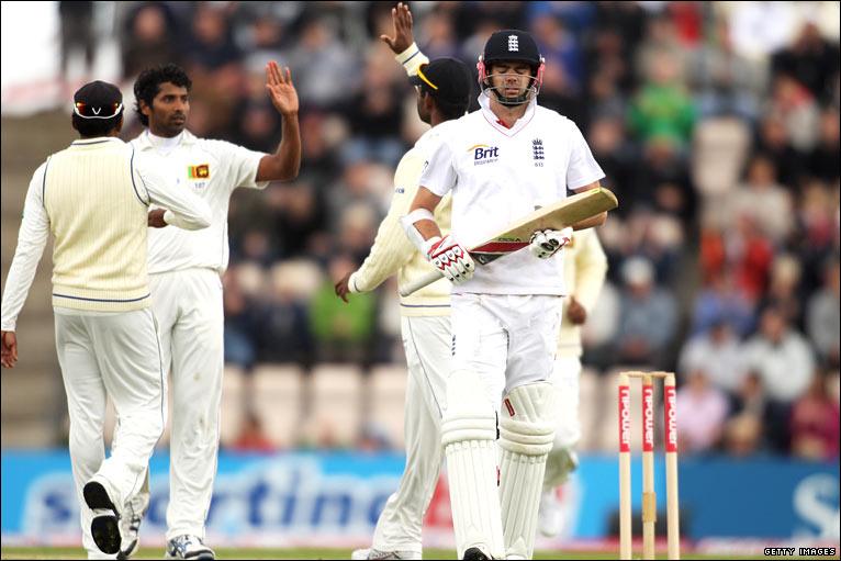 Nightwatchman James Anderson returns to the pavillion after his early dismissal