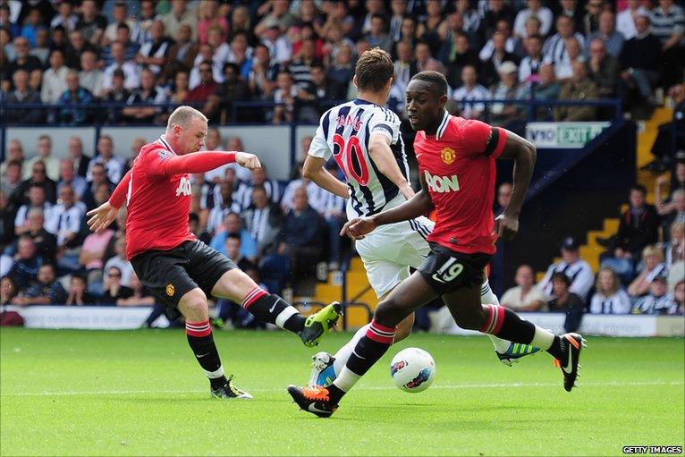 Wayne Rooney (left) scores for Manchester United