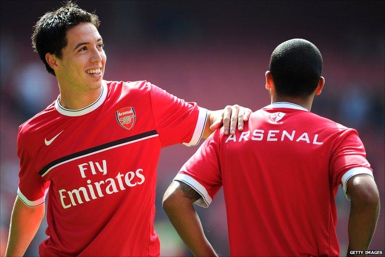 Samir Nasri warms up with Theo Walcott