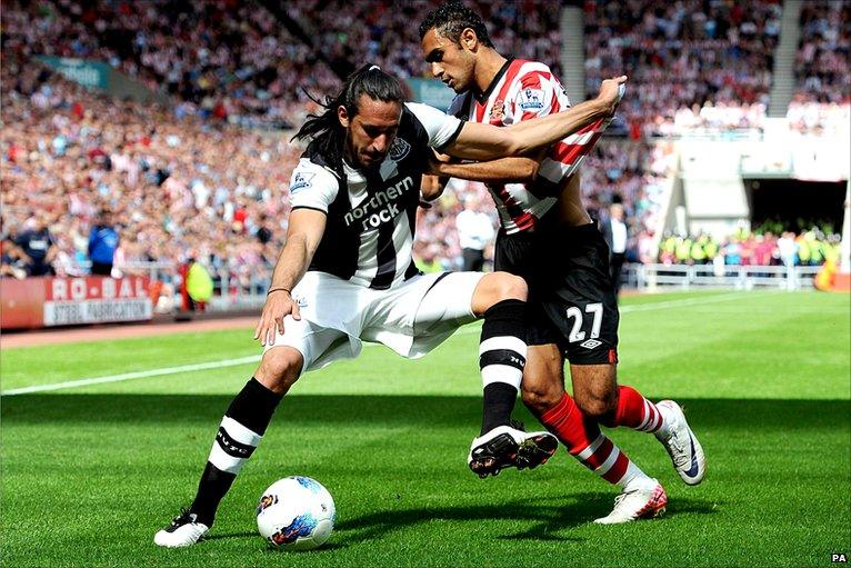 Jonas Gutierrez and Ahmed Elmohamady grapple