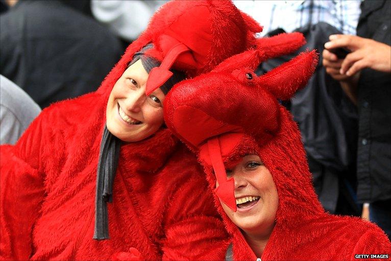 Swansea fans dressed as dragons