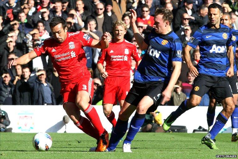 Jose Enrique evades Phil Jones