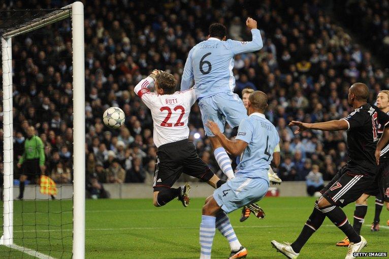 Joleon Lescott challenges the Bayern Munich goalkeeper Hans Jorg Butt