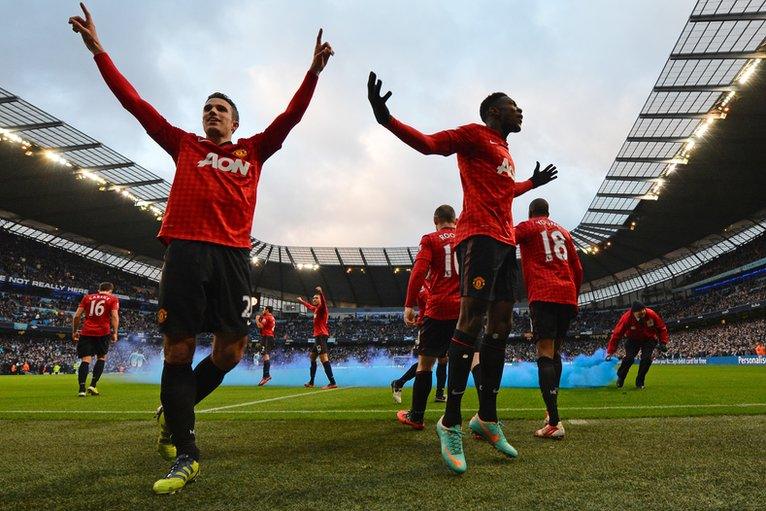 Robin van Persie (left) celebrates his winner at Manchester City