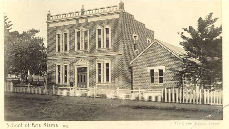 A sepia photo of a late 19th century house-like brick building