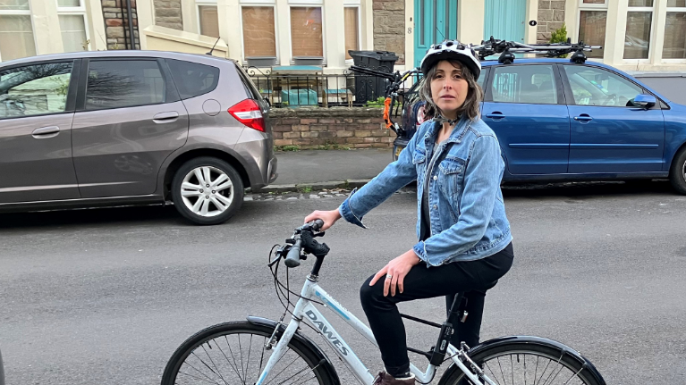 Woman on bike in street