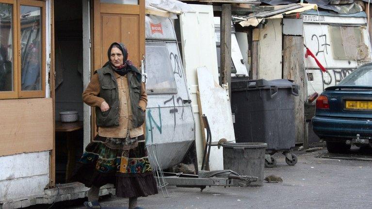 A woman enters a Roma camp outside Paris (file pic from 2007)