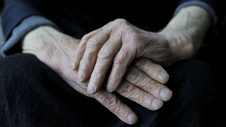 Hands of elderly person