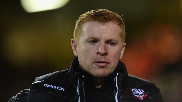 Neil Lennon looks on