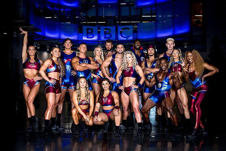 the series one gladiators line up posing for a photo outside BBC new broadcasting house in London