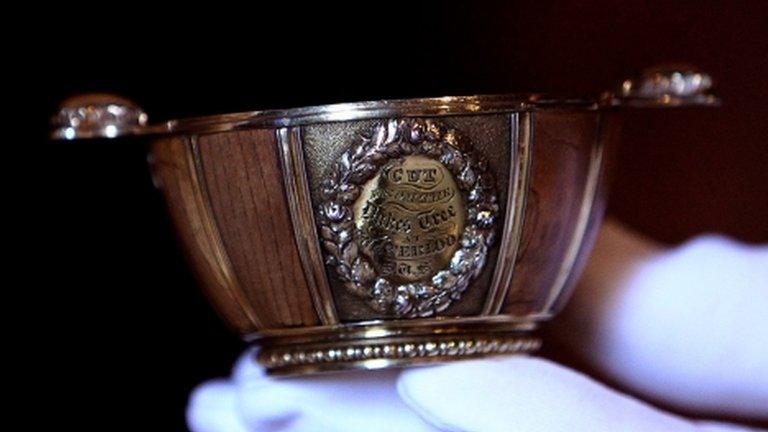 A member of staff at Abbotsford house holds The Waterloo Tree Quaich