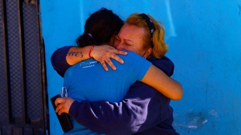 Two women comfort each other an attack in Ciudad Juárez. Photo: 12 February 2022