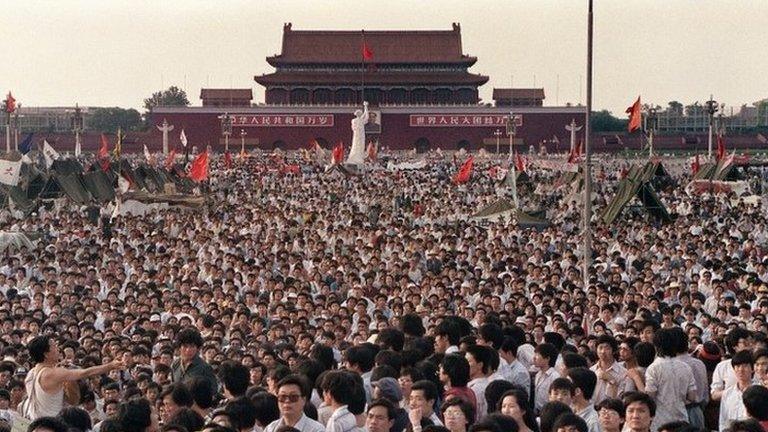 This file photo taken on 2 June 1989 shows hundreds of thousands of Chinese gathering around a 10-metre replica of the Statue of Liberty (C), called the Goddess of Democracy, in Tiananmen Square demanding democracy despite martial law in Beijing