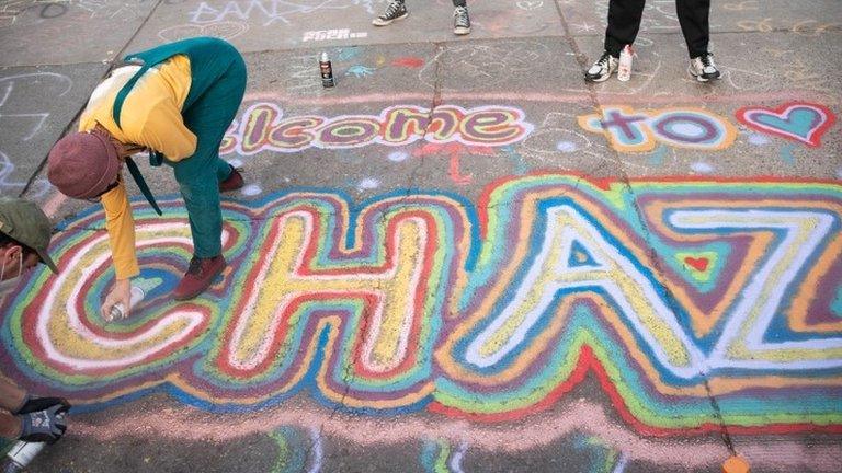 "Welcome to Chaz" is written in spray paint in Seattle