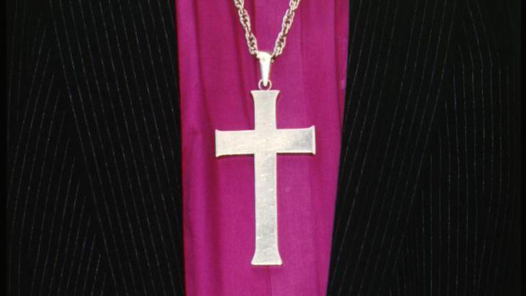 Religious cross and clothing of Church of England Bishop