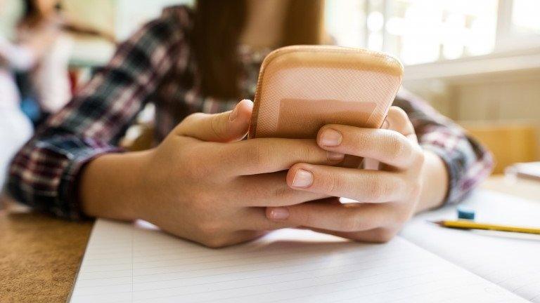 Close-up of girl using mobile phone