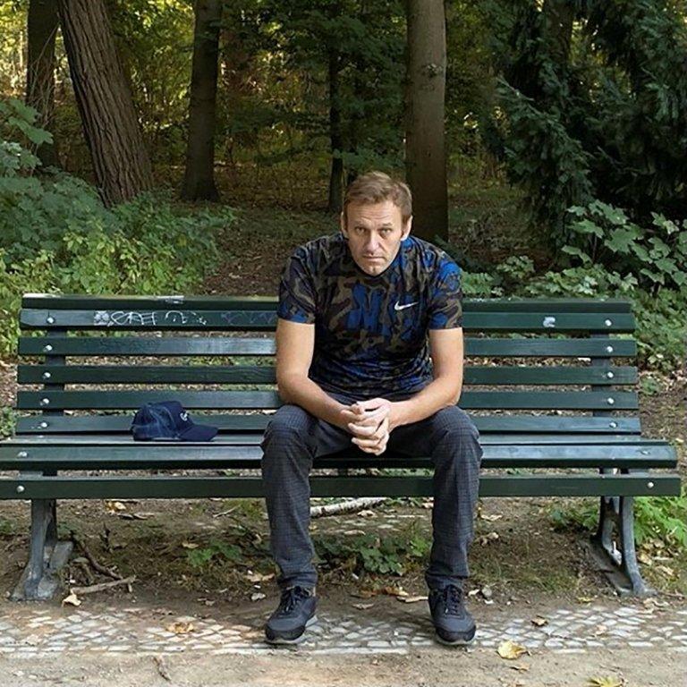 Navalny sits on a park bench in a photo uploaded to his Instagram account