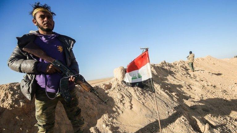 A fighter of a militia group allied with Iraqi government troops in the village of Ayn al-Hisan, west of Mosul. Photo: 18 February 2017